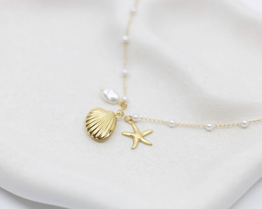 sea themed bracelet with charms on white plate