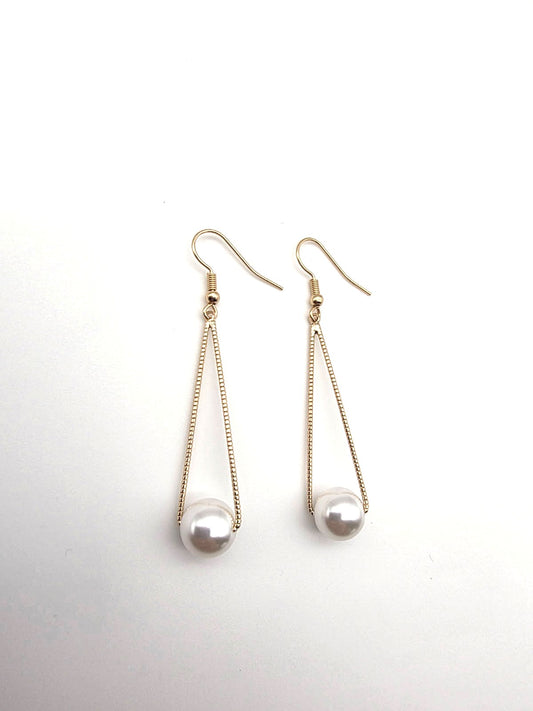 Pair of pearl earrings on a white background